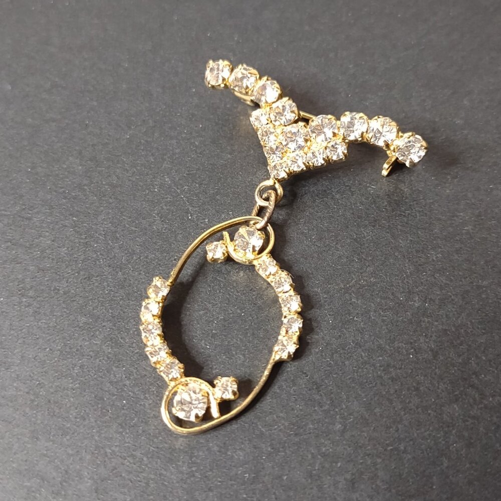 Gold Tone Dangle Brooch With Clear Stones